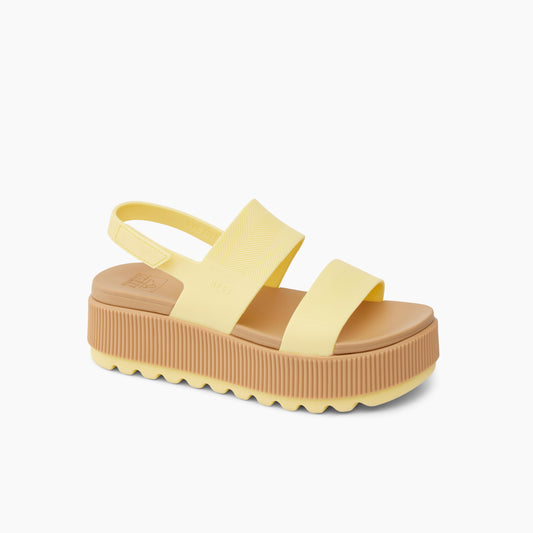 Yellow platform sandal with two straps and a slingback.