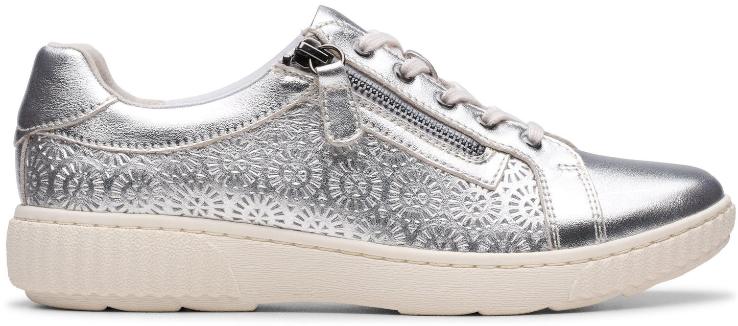 Silver sneaker with zipper detail.