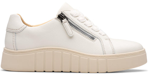White leather sneaker with a side zipper and a tan platform sole.