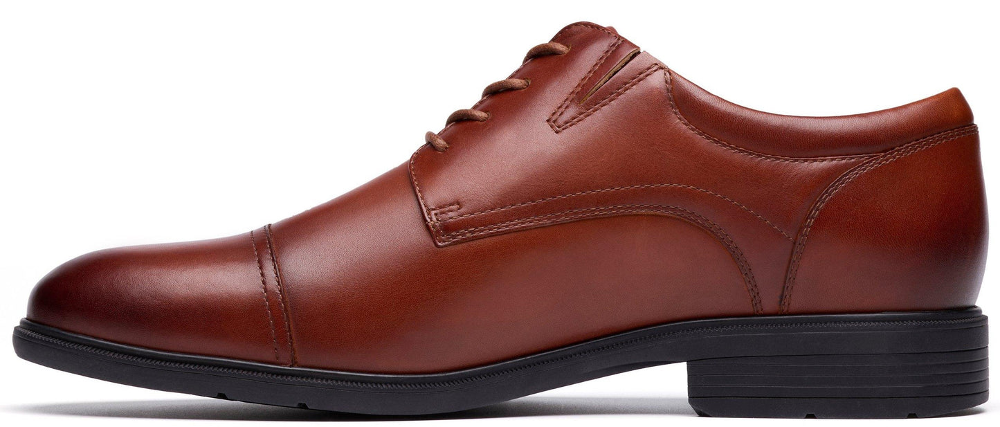 A brown leather dress shoe with a black sole and heel.