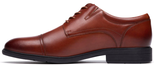 A brown leather dress shoe with a black sole and heel.