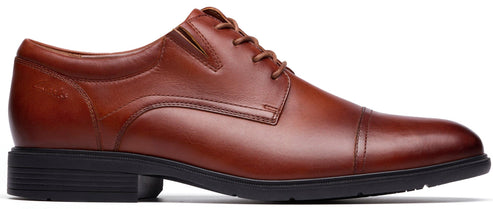 Brown cap toe dress shoe with black sole.