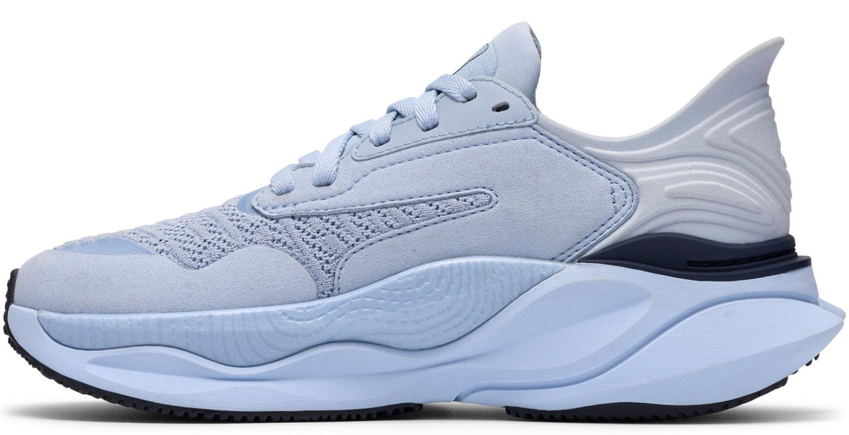 A light blue sneaker with a thick sole.