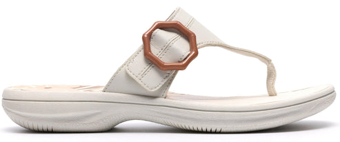 Off-white sandal with a decorative buckle.