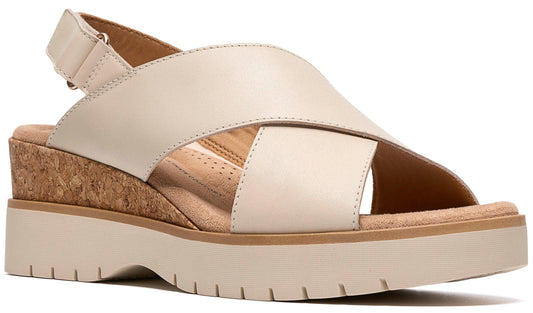 Beige platform sandal with cork wedge and criss-cross straps.