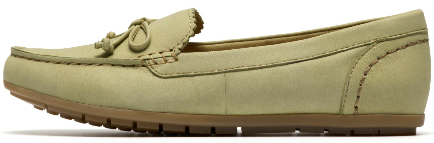 Side view of a light green loafer with a brown sole.