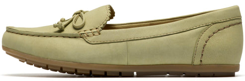 Side view of a light green loafer with a brown sole.
