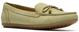 A pale green leather loafer with a decorative bow and a scalloped edge.