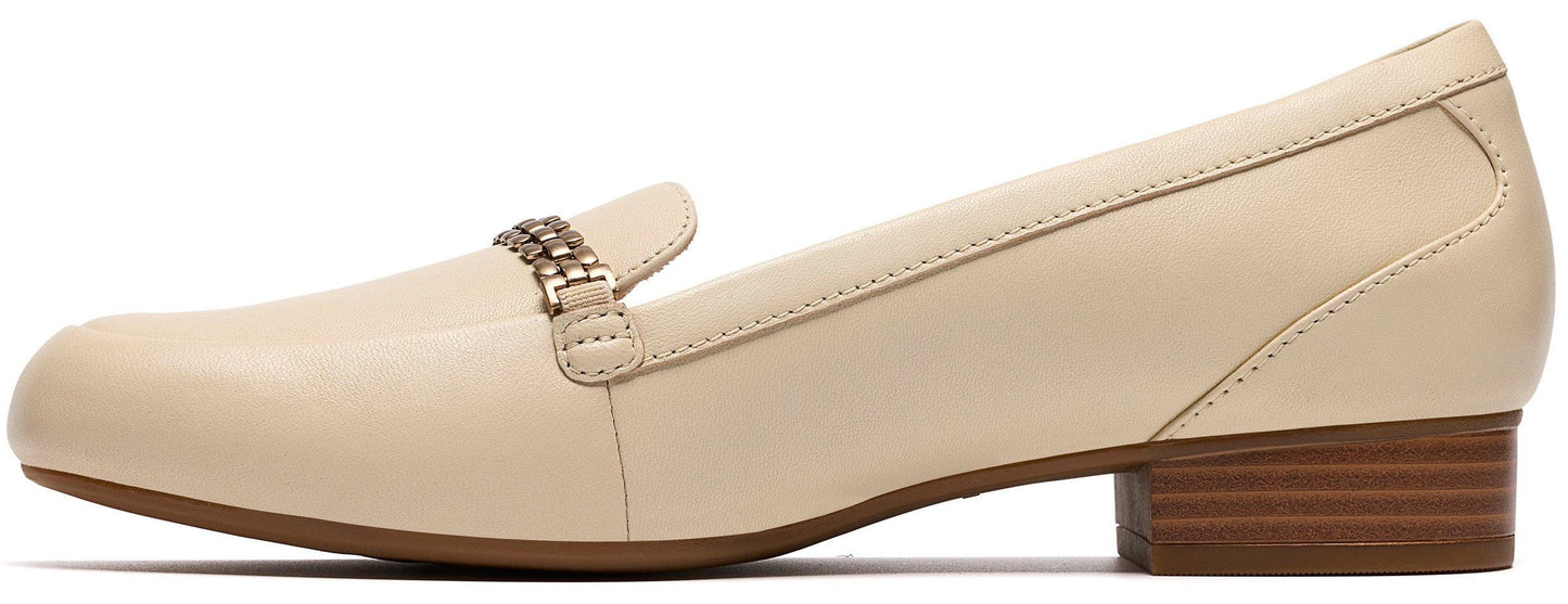 Beige loafer with a metallic accent.