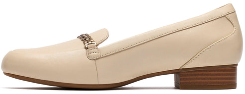 Beige loafer with a metallic accent.