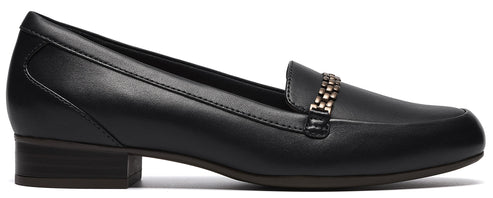 A black leather loafer with a small block heel and a decorative metallic gold chain across the upper.