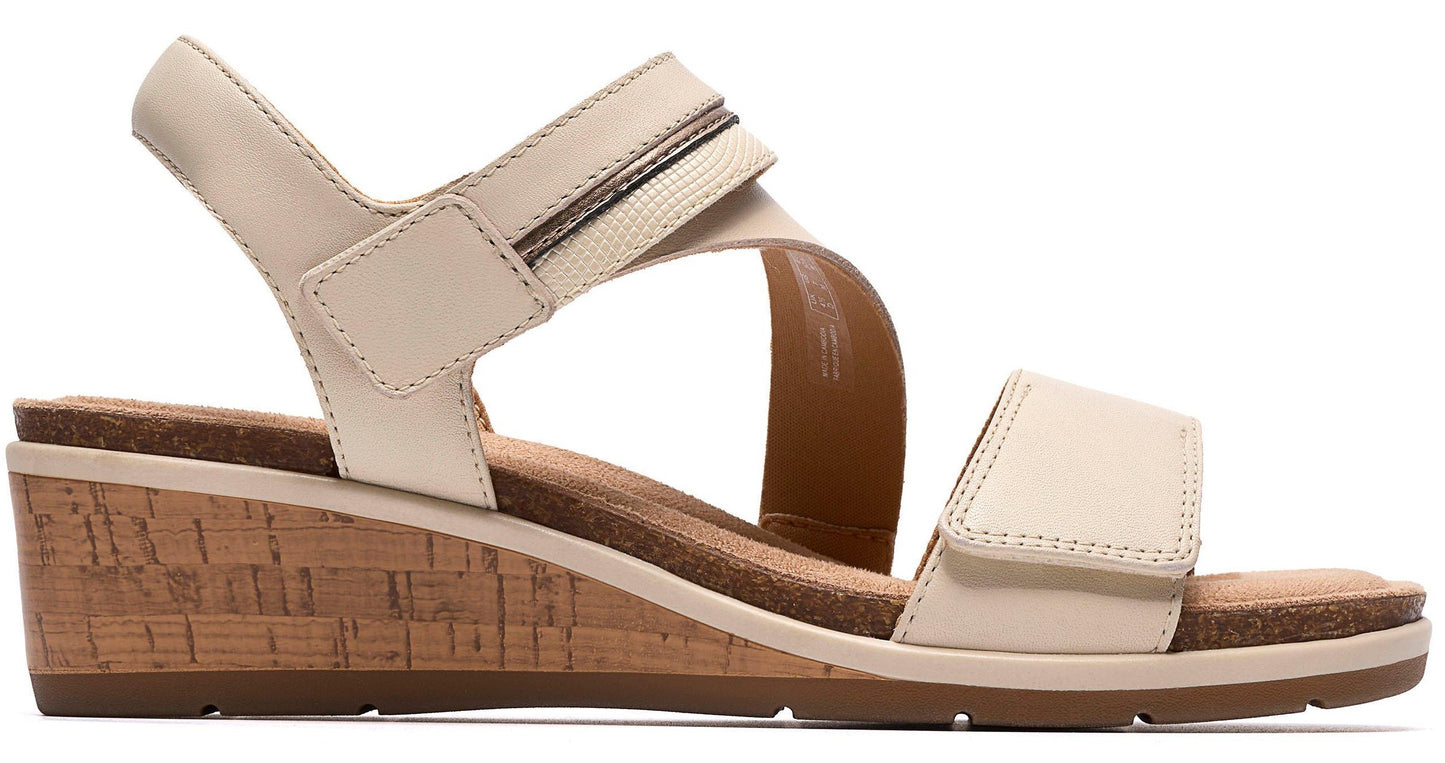 Wedge sandal with adjustable straps and cork midsole.