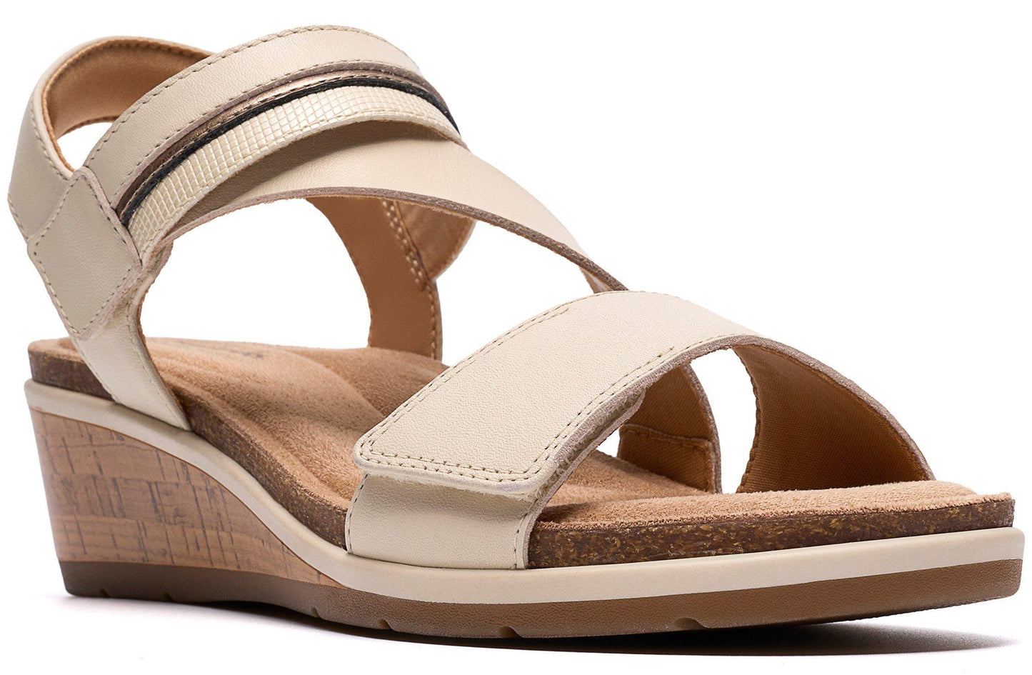 Beige wedge sandal with hook and loop straps.