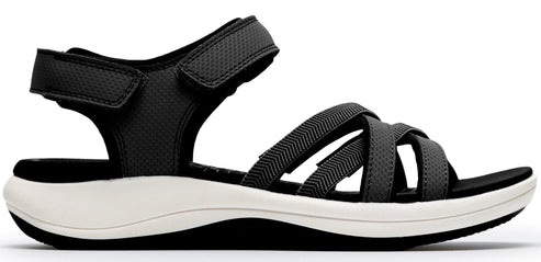 A black sandal with multiple straps and a hook and loop fastener.