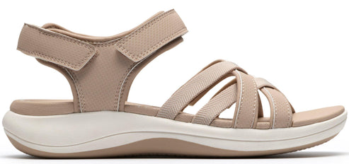 A beige sandal with multiple straps and an adjustable velcro strap.