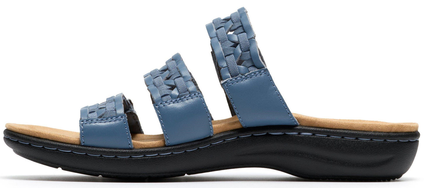 A light blue sandal with a woven strap design and a black sole.