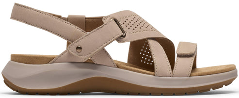 A beige sandal with adjustable straps and a perforated top.