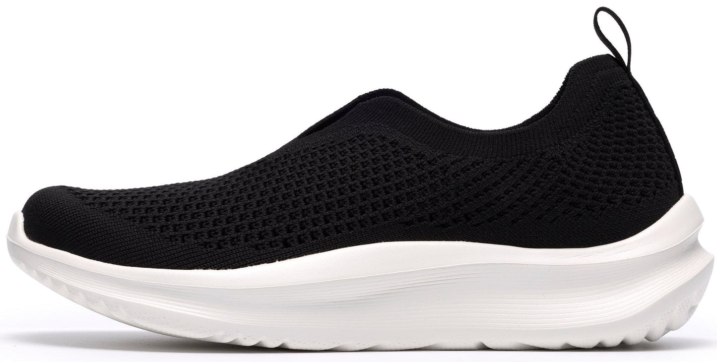Black knit slip-on sneaker with a thick white sole and a pull tab.
