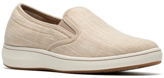 Beige slip-on shoe with a neutral sole.