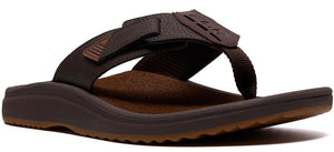 A brown sandal with a thick sole and a toe post.