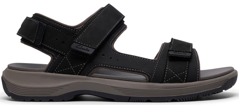 A black sandal with velcro straps.