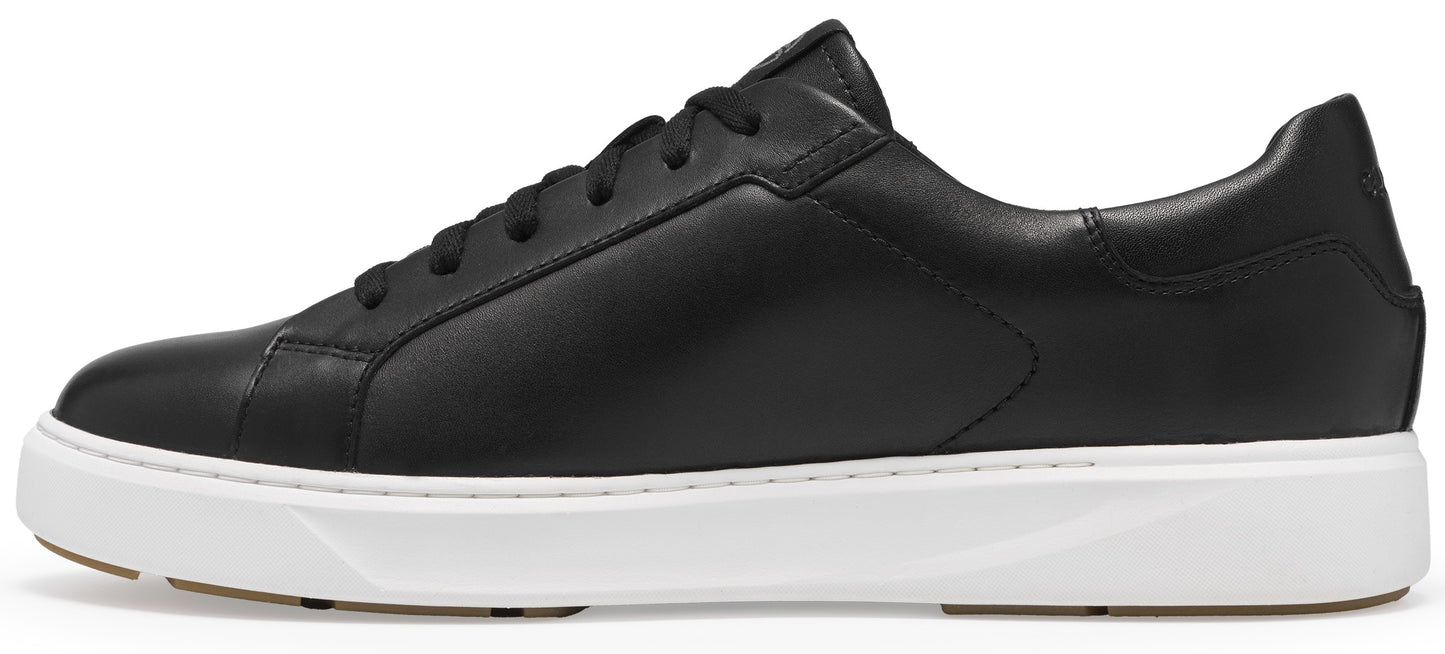 A minimalist black leather sneaker with a clean silhouette, black laces, and a thick, flat white rubber sole.