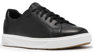 A minimalist black leather low-top sneaker with black laces, a clean white rubber midsole, and a gum-colored outsole.