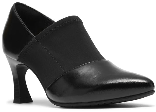 A black slip-on pointed-toe pump shoe with a flared kitten heel, featuring a smooth faux leather toe and heel cup contrasted with a matte fabric mid-section.