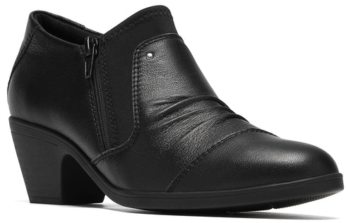 A black leather ankle boot with a block heel, a side zipper, and gathered pleating details on the upper vamp.