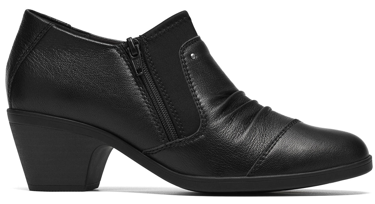 A black leather ankle boot with a low block heel, a side zipper closure, and a gathered, ruched toe section.