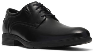A black leather dress shoe with a rounded toe, a lace-up front, and a low, textured rubber sole.