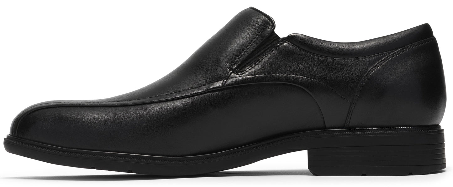 A black leather slip-on dress shoe shown in profile, featuring a smooth toe cap, elastic side gussets for easy entry, and a flat rubber sole with a low heel.
