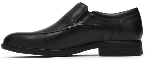 A black leather slip-on dress shoe shown in profile, featuring a smooth toe cap, elastic side gussets for easy entry, and a flat rubber sole with a low heel.