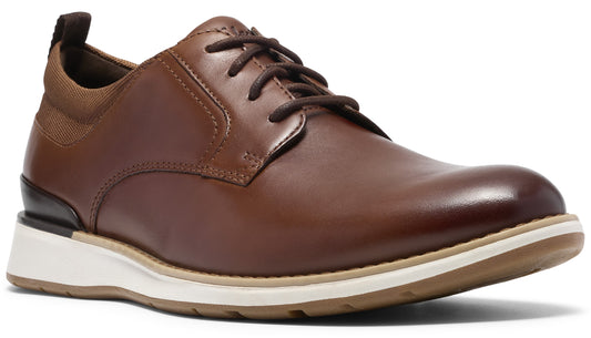 A brown leather dress shoe with brown laces, a white midsole, and a tan rubber outsole, featuring a brown fabric collar and a pull tab.