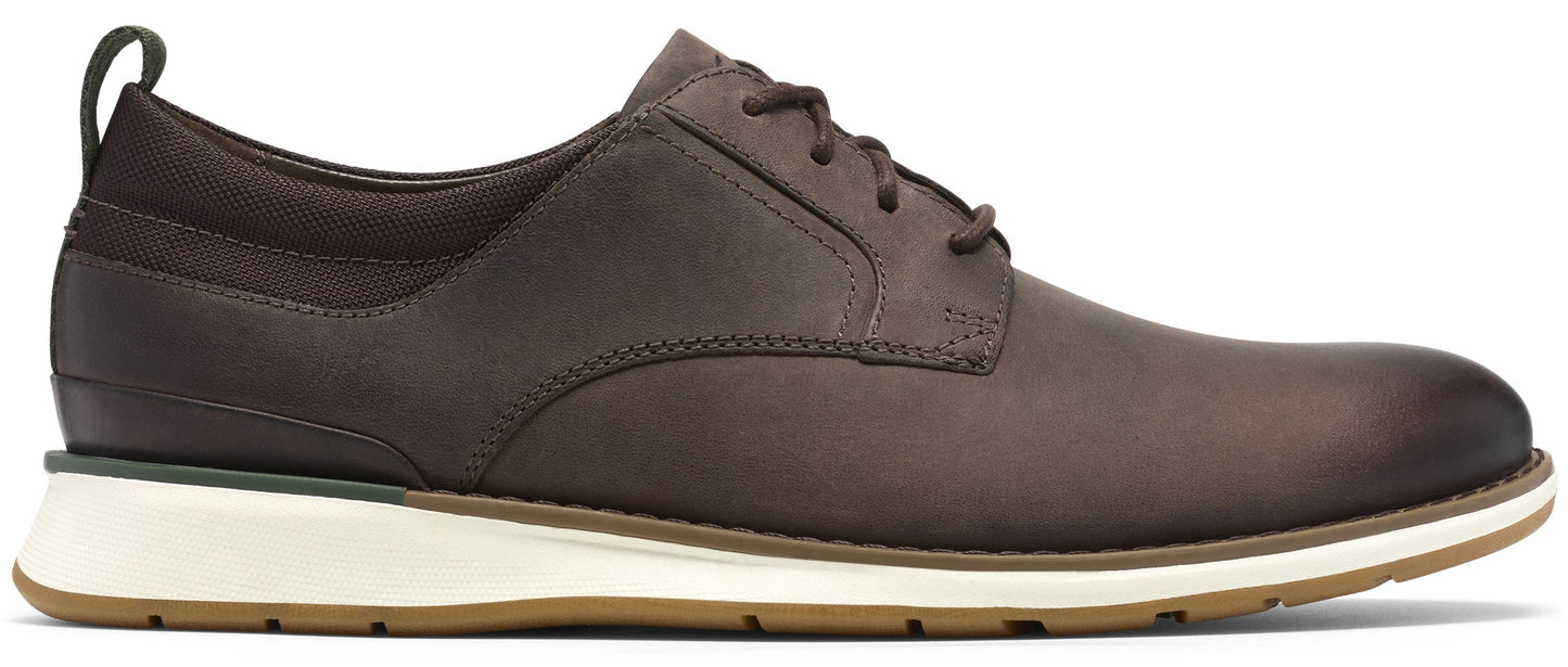 A brown leather oxford shoe with a lace-up front, a dark brown fabric heel collar with a pull tab, a thick white midsole, and a tan rubber outsole.