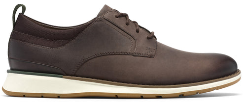 A brown leather oxford shoe with a lace-up front, a dark brown fabric heel collar with a pull tab, a thick white midsole, and a tan rubber outsole.