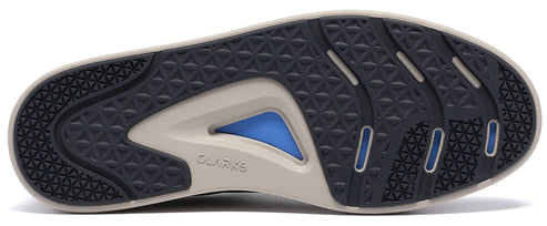 A bottom view of a shoe sole showing a dark blue tread pattern with geometric detailing and a light beige frame, featuring a triangular blue insert in the middle and the text 'CLARKS' embossed on the side.