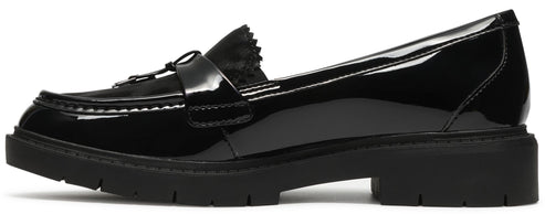 A black patent leather loafer with a thick, lugged rubber sole and a classic penny slot strap across the vamp.