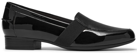 A black slip-on loafer made of a combination of shiny patent leather and a textured matte panel, featuring a thick black elastic band across the instep and a low, block heel.