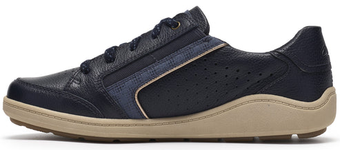 A profile view of a dark navy blue, lace-up leather sneaker with a textured surface, perforated side panel, and a light tan contoured rubber midsole.