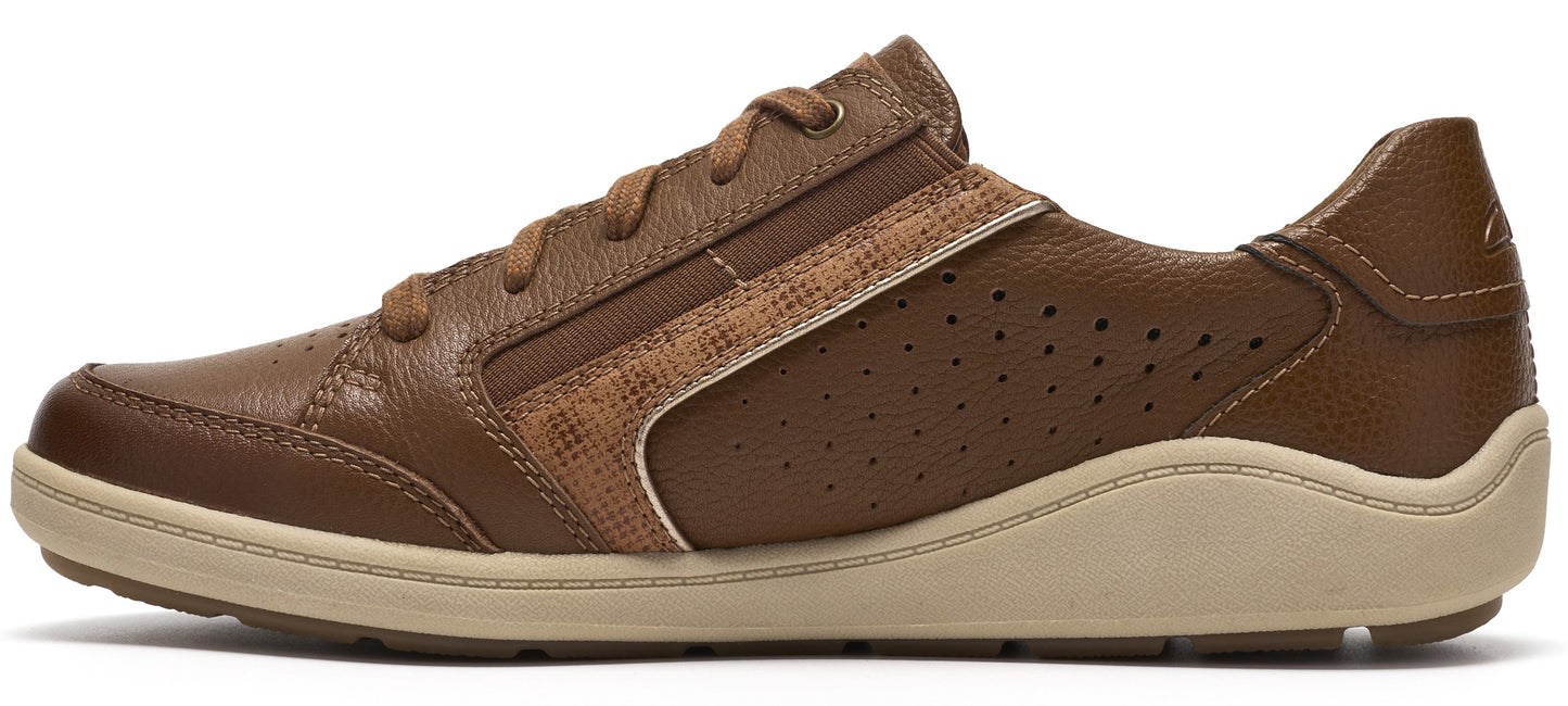 A brown leather sneaker featuring a textured snakeskin-patterned accent along the side, perforated side panels for ventilation, and a thick, wavy-edged cream-colored rubber sole with matching brown laces.