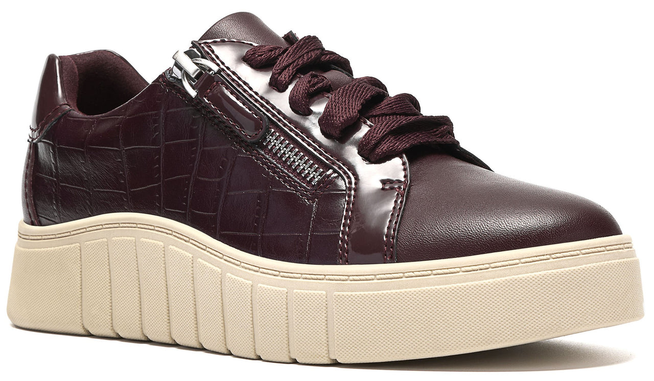 A dark burgundy, croc-embossed leather platform sneaker with a side zipper detail, matching laces, and a thick, ridged, off-white rubber sole.