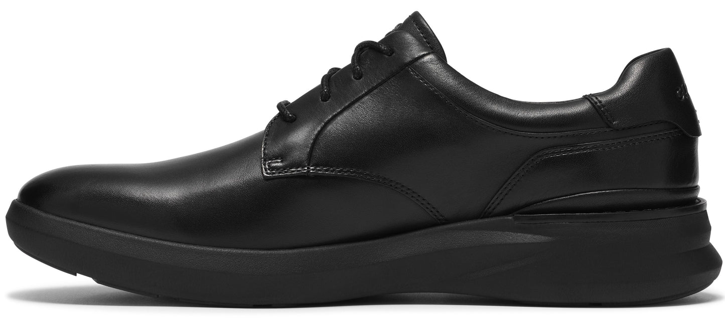 A sleek, black leather oxford shoe with a low profile, black rubber sneaker-style sole, viewed from the side.