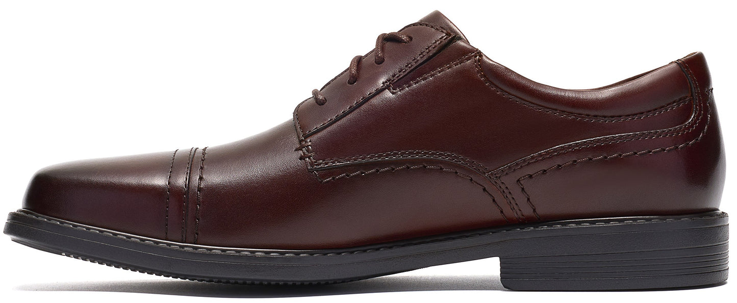 A brown leather men's dress shoe with a cap-toe design, a four-eyelet lace-up closure, and a dark grey rubber outsole.