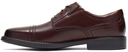 A brown leather men's dress shoe with a cap-toe design, a four-eyelet lace-up closure, and a dark grey rubber outsole.