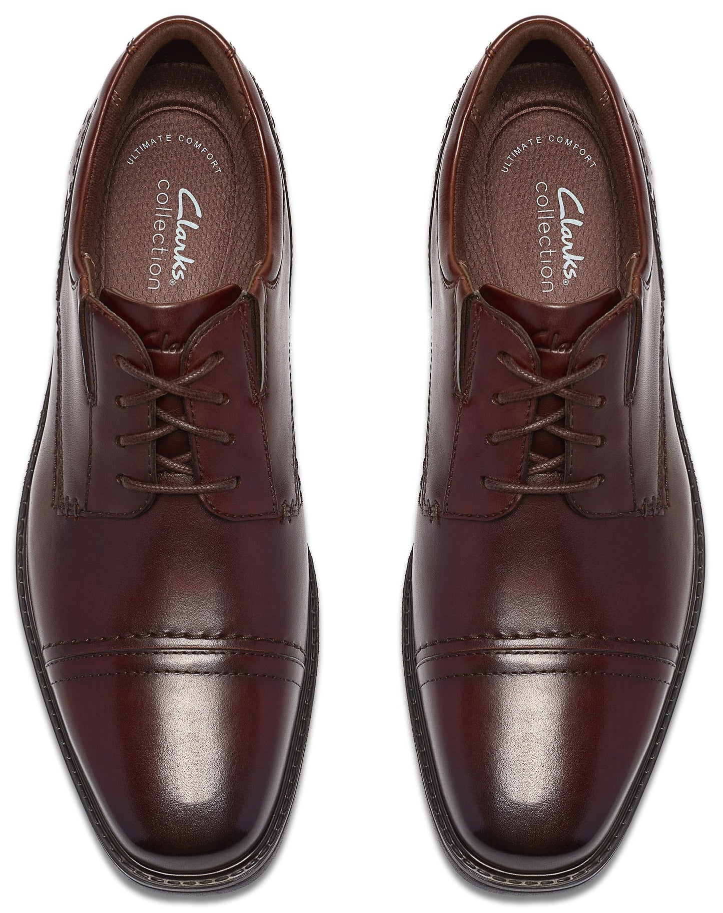 A pair of dark brown leather oxford-style dress shoes with cap toes and laces, viewed from directly above, showing the Clarks Collection logo on the inner footbeds.