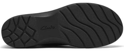 The black sole of a shoe, featuring the embossed word Clarks in the center, with a grid-like tread pattern at the heel and wavy horizontal grooves across the forefoot.