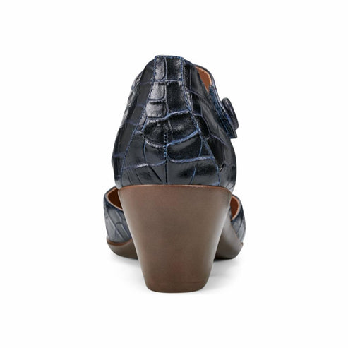 Back view of a dark blue faux crocodile leather shoe with a brown, cone-shaped heel and a single, side-fastening strap.