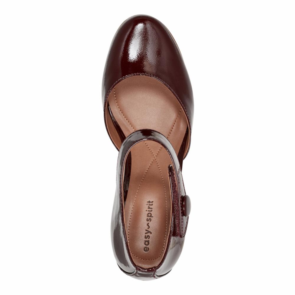 Overhead shot of a shiny dark red patent leather pump shoe with a buckled ankle strap. The insole is visible and shows 'easy spirit' in tan-colored letters.