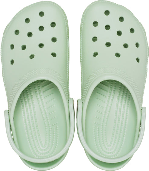 Pair of light green clogs with ventilation holes.